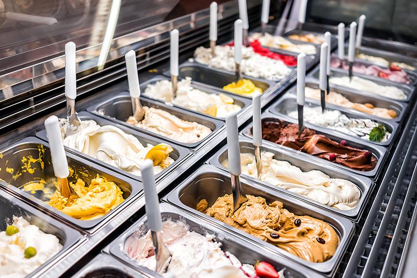 closeup of display case full of frozen ice cream