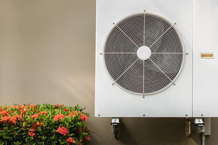 compressor air conditioning system mounted on building exterior wall