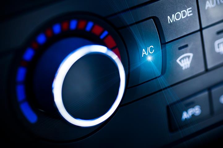 closeup of car temperature control knob and defroster